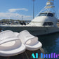 White slip resistant non-marking slides in front of a large white boat in a harbour.